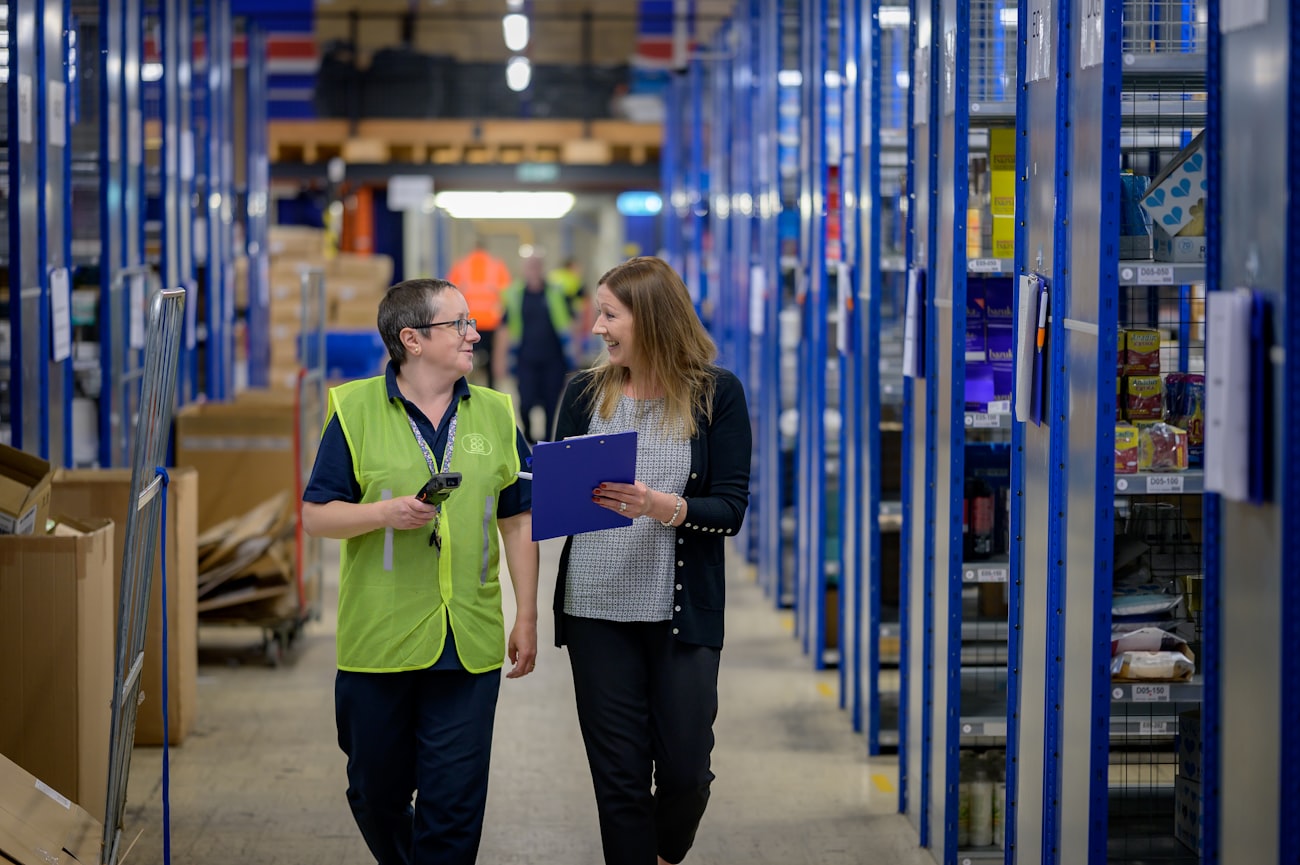 A man and a woman in a warehouse